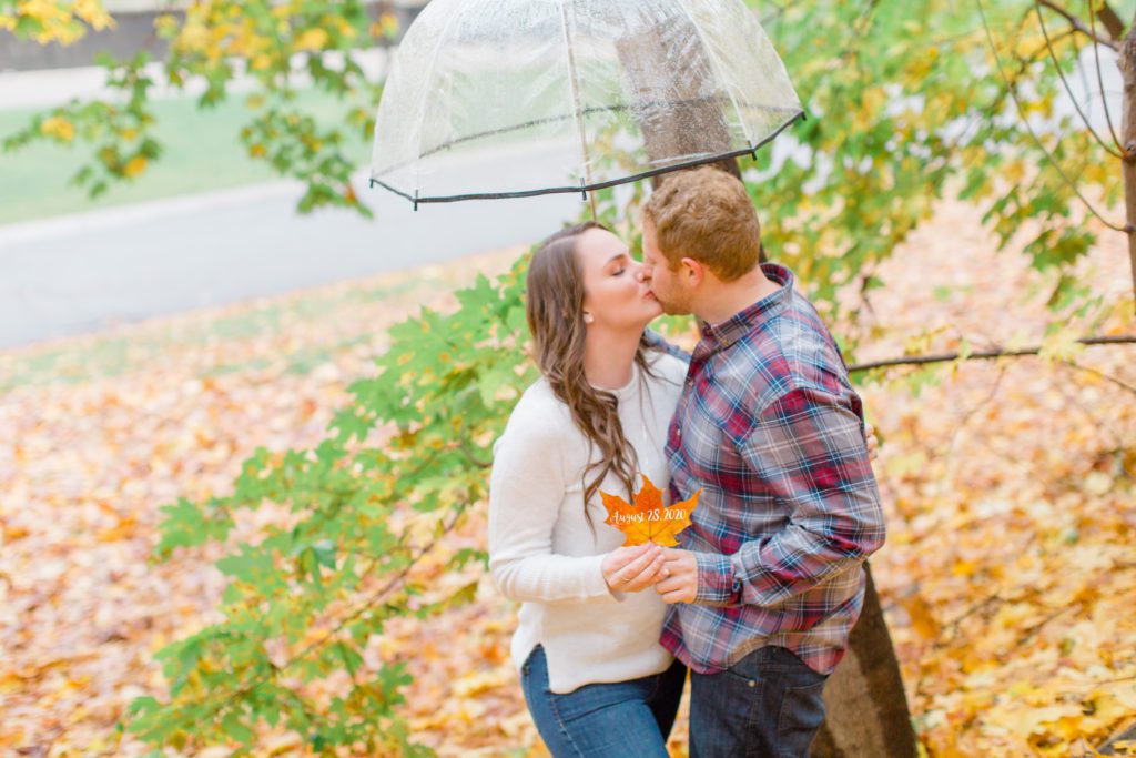 couple kissing holding a leaf with wedding date under umbrella
- Rainy Day Engagement Session Downtown Ottawa - Photo Locations 

Grey Loft Studio - Ottawa Wedding Photographer & Videographer