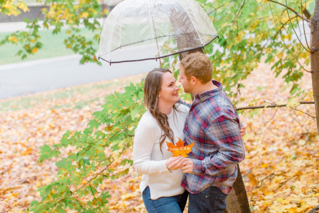 couple laughing and smiling holding a leaf in the rain
- Rainy Day Engagement Session Downtown Ottawa - Photo Locations 

Grey Loft Studio - Ottawa Wedding Photographer & Videographer