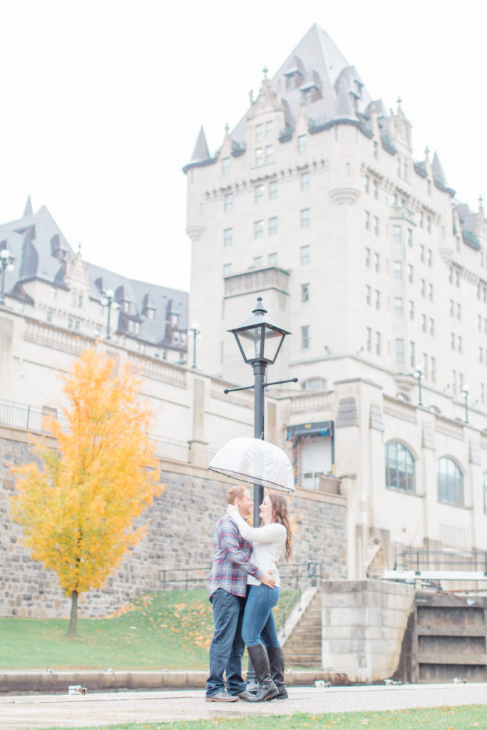 Couple standing in the rain during engagement session with the Locks and Chateau Laurier in the background

- Rainy Day Engagement Session Downtown Ottawa - Photo Locations 

Grey Loft Studio - Ottawa Wedding Photographer & Videographer