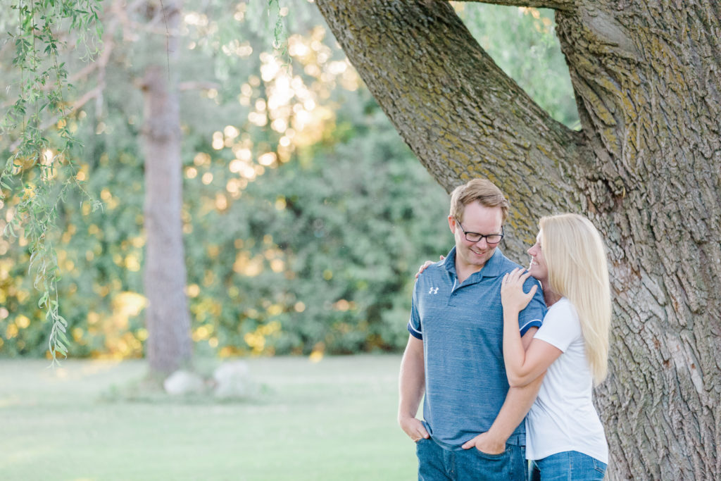 couple interacting on a family farm in Carp during an engagement session