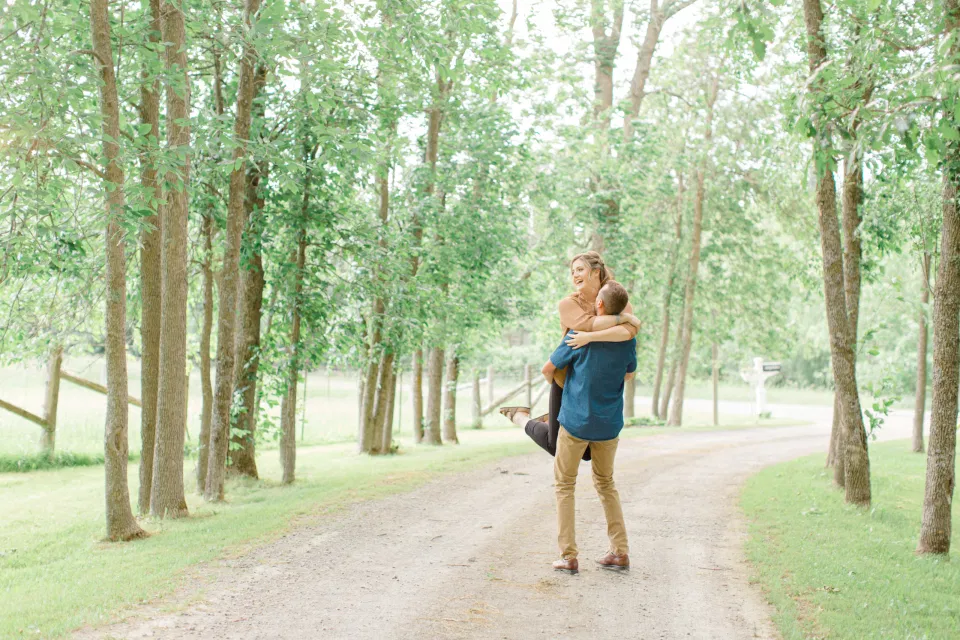 Frolic - Natural Posing for Photo Session - Couples Photo Session Fun - Fun on the Farm - Farm Engagement Session - Blue and Brown Engagement Session Inspiration - Natural Engagement Session Posing - Ideas for what to wear for Engagement Photography, Modern Engagement Session Inspiration Wardrobe Ideas. Unsure of what to wear for your engagement photos, we've got you! Romantic brown with black leggings for Summer Engagement in Almonte. Grey Loft Studio is Ottawa's Wedding and Engagement Photographer for Real couples, showcasing photos that are modern, bright, and fun.