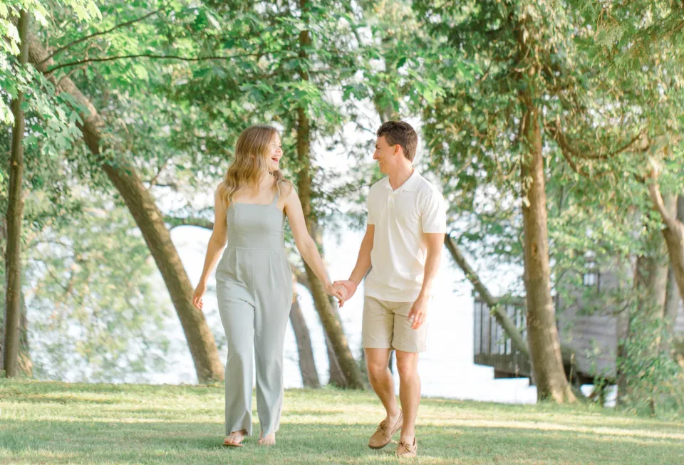 Ideas for what to wear for Engagement Photography, Modern Engagement Session Inspiration Wardrobe Ideas. Unsure of what to wear for your engagement photos, we've got you! Romantic blue Romper and neutral Shirts and polo. Boat Shoes and Flip Flops. Engagement in Gananoque. Grey Loft Studio is Ottawa's Wedding and Engagement Photographer Videographer for Real couples, showcasing photos that are modern, bright, and fun.
