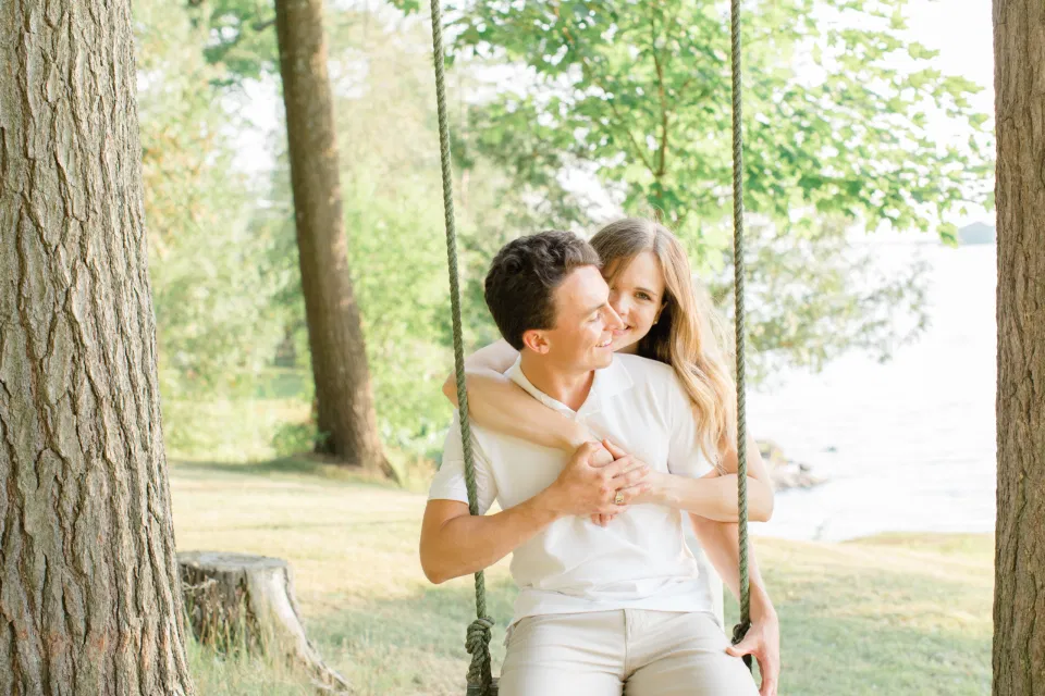 Swing Photo Ideas - Ideas for what to wear for Engagement Photography, Modern Engagement Session Inspiration Wardrobe Ideas. Unsure of what to wear for your engagement photos, we've got you! Romantic blue Romper and neutral Shirts and polo. Boat Shoes and Flip Flops. Engagement in Gananoque. Grey Loft Studio is Ottawa's Wedding and Engagement Photographer Videographer for Real couples, showcasing photos that are modern, bright, and fun.
