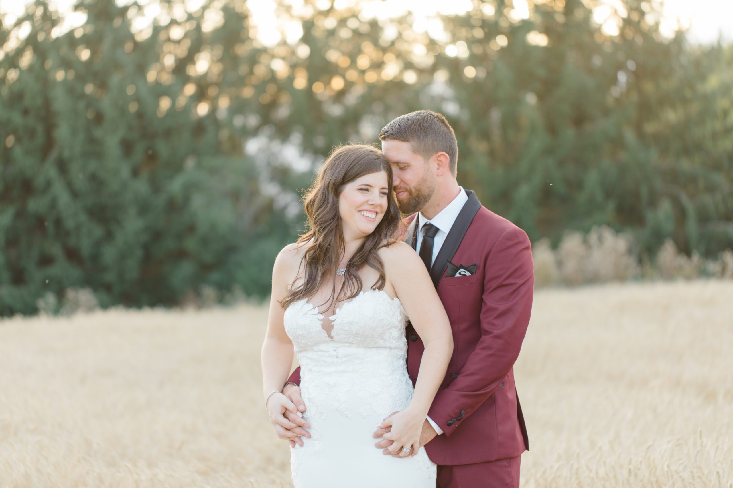Bride and Groom Posing in Wheat Field at Evermore Weddings and Events Almonte - Grey Loft Studio